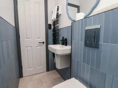 A bathroom with a sink and toilet at Apartment Blue in Whitby