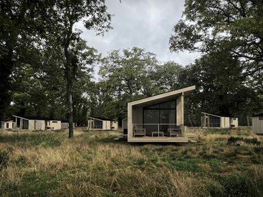 A view of a wooden cabin in a natural setting at Arbora 1.0 Spa (Pet) Malvern