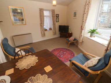A living room with a table and chairs at Chyancrowse in Gulval