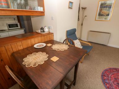 A dining room with a table and chairs at Chyancrowse in Gulval