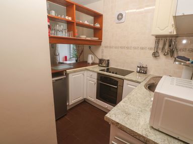 A kitchen with appliances and storage at Chyancrowse in Gulval