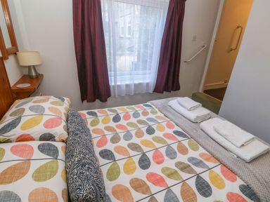 A bedroom with beds and a lamp at Chyancrowse in Gulval