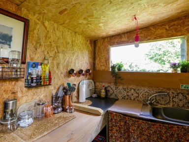 A kitchen with a countertop and sink at The Little Shepherds Hut with a View Builth Wells
