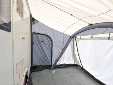 An interior view of a caravan with a tent structure at Caravan in Dolton