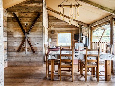 A dining room with a table and chairs at Luxury Safari Lodge Sleeps 4/6 Deer Park Dogs Ok Zeal Monachorum near Bow