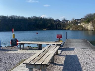 A pier with benches and a water view at a quarry site