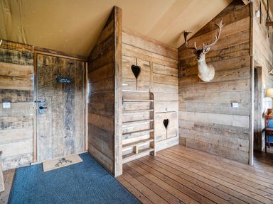An entryway with wooden walls and a staircase at Luxury Safari Lodge Sleeps 4/6 Deer Park Dogs Ok Zeal Monachorum near Bow
