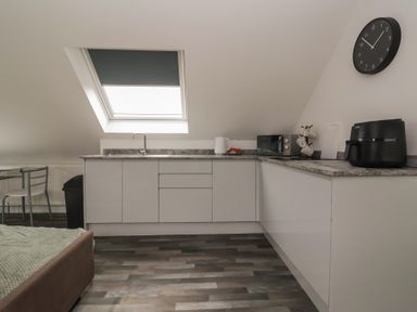 A kitchen with appliances and a table at Fields view in Bridlington