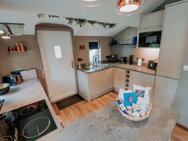 A kitchen with a sink and counters at TyCosy St Davids