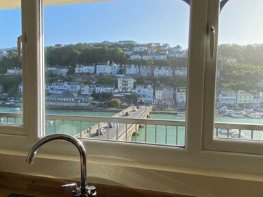 A view from a kitchen window showing a bridge and waterfront at Rivercrest in Looe