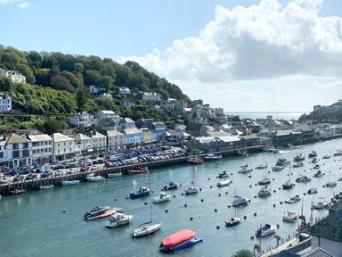 A harbor with boats and houses overlooking at Nesden House in 