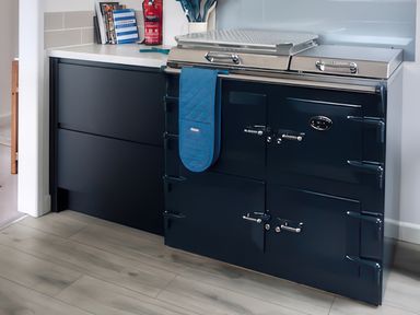 A kitchen with a cooker and countertop at Sleeps 9 KingBeds Family Friendly in Pityme near Penmayne