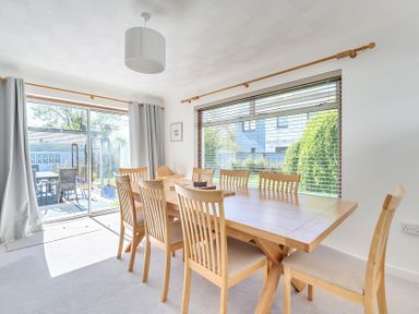 A dining room with a large table and several chairs at Sleeps 9 KingBeds Family Friendly Pityme near Penmayne