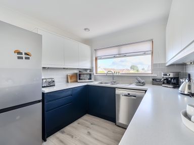 A kitchen with appliances and sink at Sleeps 9 KingBeds Family Friendly, Pityme near Penmayne
