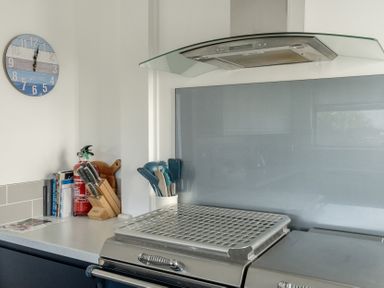 A kitchen with an extractor hood and utensils at Sleeps 9 KingBeds Family Friendly in Pityme near Penmayne