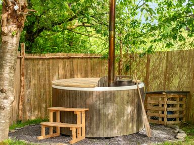 A hot tub in an outdoor area at Sleeps 2 - Private Hot Tub - Fire Pit, St. Dogmaels near Cardigan