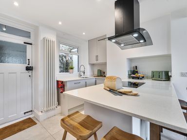 A kitchen with a countertop and sink at Looe Cottage Seaside views log fire sleeps 4 in Looe