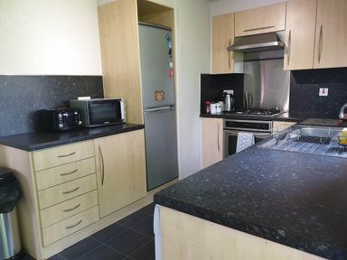 A kitchen with appliances and cabinets at 
