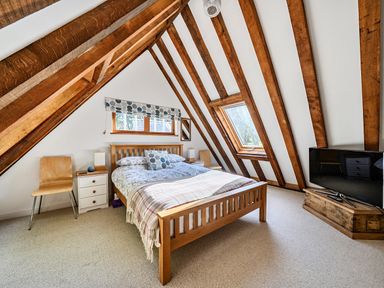 A bedroom with a bed and television at Cabin Sleeps 6 with Parking and Patio, Tremail near Camelford