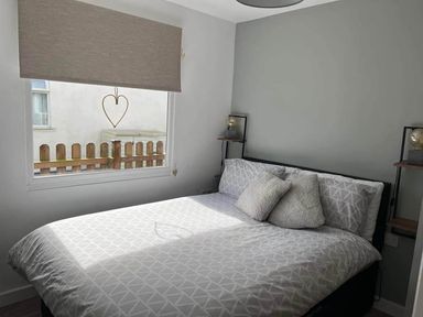 A bedroom with a bed and window at the property in Bridlington