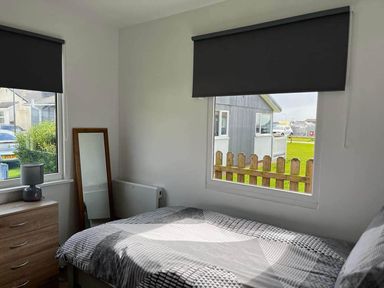 A bedroom with a bed and a window at the property in Bridlington