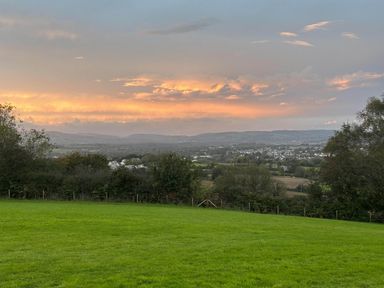 A landscape view with grass and hills at a property in Newton Abbot