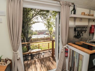 A kitchen with an outdoor view at Owls Roost in Robin Hood’s Bay