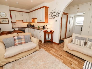A kitchen with seating area in an open layout at Spinnaker