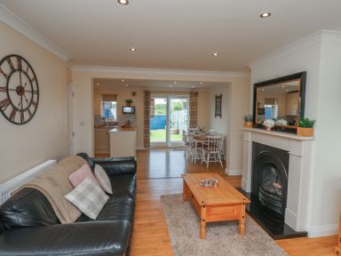 A living room with a sofa and coffee table at The Cosy Haven in Malton