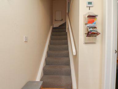 A staircase leading upstairs in The Cosy Haven in Malton