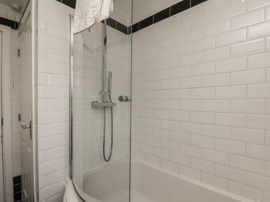 A bathroom with a bathtub and a shower at The Cosy Haven in Malton