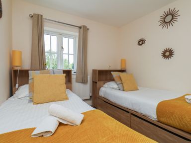 A bedroom with two single beds at The Cosy Haven in Malton