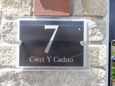 A house number plaque at 7 Cwrt Y Cadno in Llantwit Major
