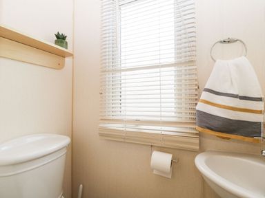 A bathroom with a toilet and sink at The Hideaway in Portesham
