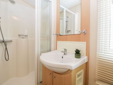 A bathroom with a shower and sink at The Hideaway in Portesham
