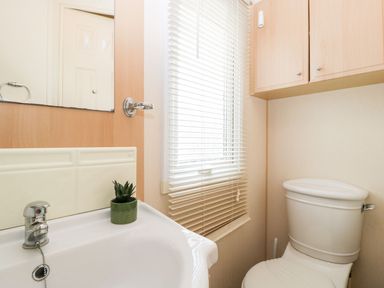 A bathroom with a sink and toilet at The Hideaway in Portesham