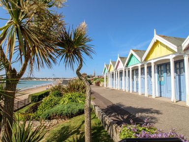 A row of beach huts along the seaside at The Hideaway in Portesham