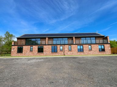 A building with windows and balconies at Sycamore Cottage in Frizington