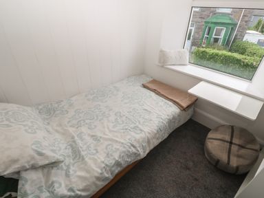 A bedroom with a bed and small table at 1 St. Day Road Redruth