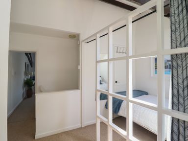 A bedroom with a bed and window at Cnicht View in Porthmadog