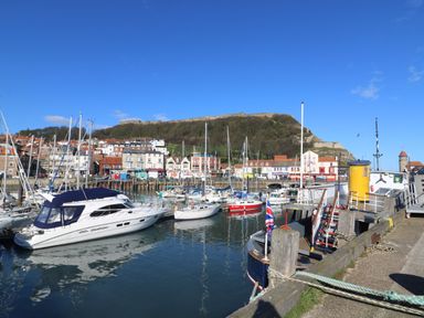 A harbor with boats and buildings at 42 Oak Green in Gristhorpe