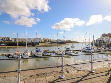 A marina with boats at Seafarer's Haven in Porthmadog