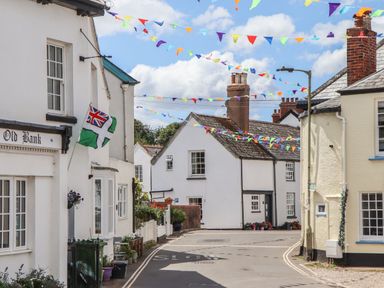 A street view with buildings and decorations at Tower View Cottage in Lympstone