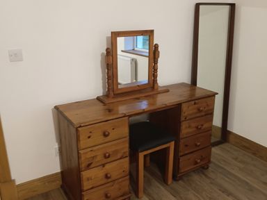 A vanity table with a mirror in a bedroom at Sliabh League Mountain Lodge TEILEANN near Kilcar, County Donegal