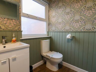 A bathroom with a sink and toilet at Lansdowne Grange in Bridlington