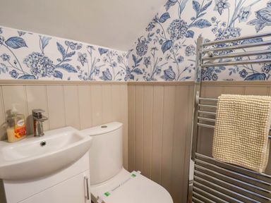 A bathroom with a sink and toilet at Lansdowne Grange in Bridlington