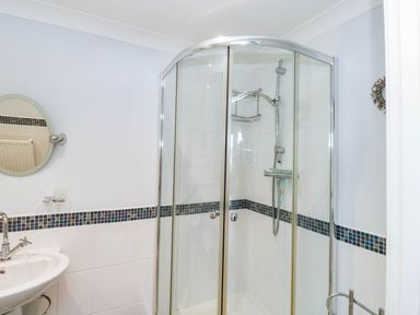A bathroom with a shower and sink at 2 Inglewood Apartments in Dartmouth