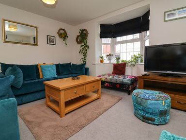 A living room with a sofa and coffee table at Manning's View in Barnstaple
