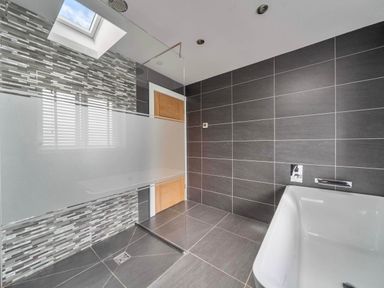 A bathroom with a bathtub and shower at Abergele