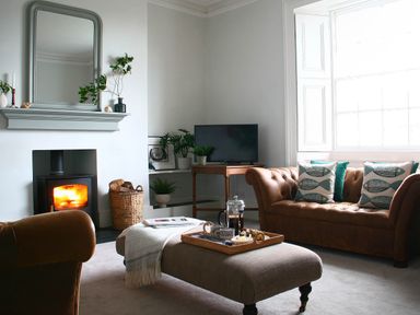A living room with a sofa, armchair, coffee table, and television at Beautiful 6Bed Sleeps 12 Stunning Views Lynton